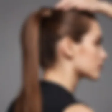 Close-up of a person applying a claw clip ponytail extension in their hair.