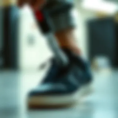 Shoe Remover Tool in Action Close-up of a shoe remover tool in use on a stylish sneaker