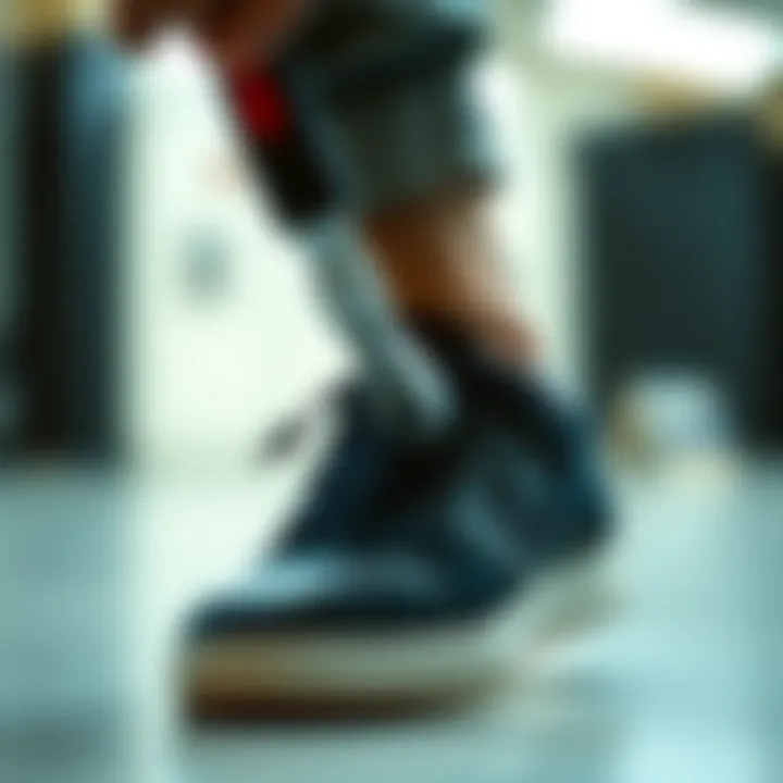 Shoe Remover Tool in Action Close-up of a shoe remover tool in use on a stylish sneaker