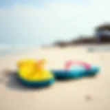 Vibrant flip flops on a sandy beach