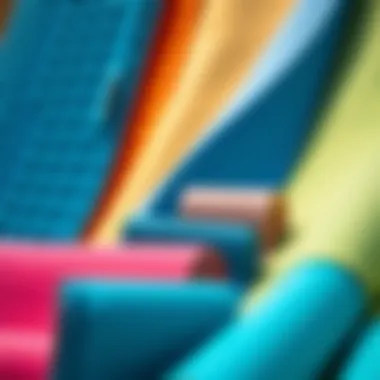 A variety of colorful anti-sand beach mats displayed together.