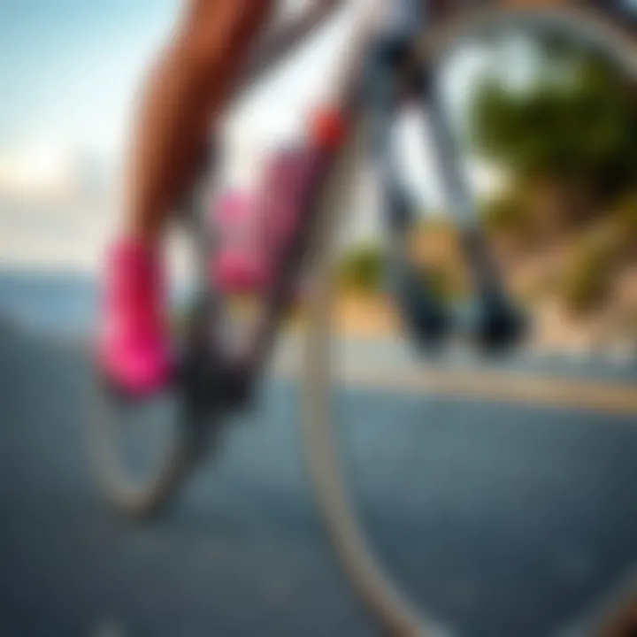 Cycling Performance with Pink Shoes Cyclist wearing pink cycling shoes on a scenic road