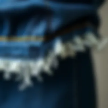 Detailing of Raw Hem on Denim Close-up view of raw hem detailing on denim fabric