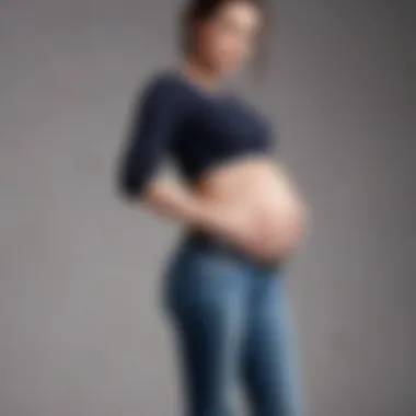 Expectant mother showcasing confidence in ripped maternity jeans