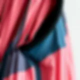 Detailed view of a color block pleated dress showcasing fabric texture and color contrast