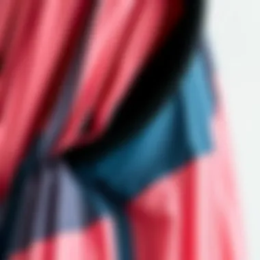 Detailed view of a color block pleated dress showcasing fabric texture and color contrast