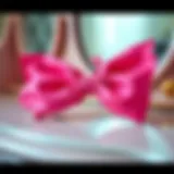 Elegant pink bow hair clip showcased on a vintage vanity