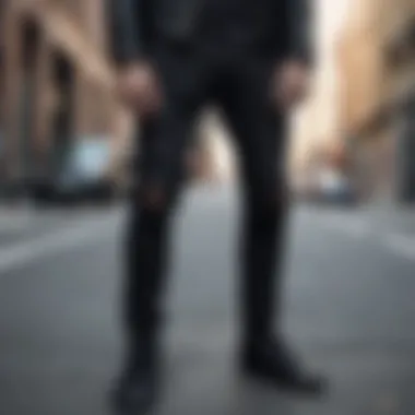 Black Ripped Jeans in Urban Setting Black ripped jeans showcased in an outdoor urban setting
