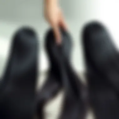 A stylish display of various lengths of black straight hair extensions arranged elegantly