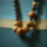 Close-up of intricately designed wooden bead lanyard showcasing natural textures