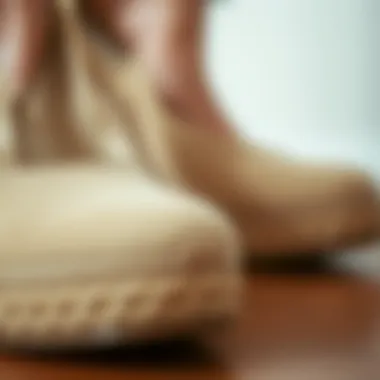 Close-up of the material used in beige wedge shoes showcasing texture