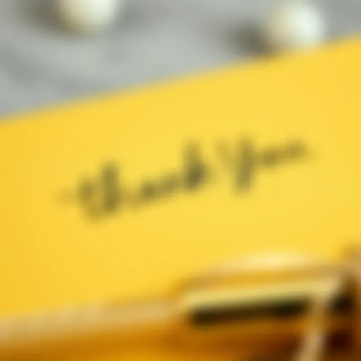 Close-up of a handwritten thank you message on a gold card