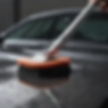 Microfiber wash brush in action on a car surface