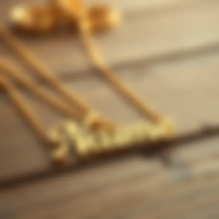 Chic Gold Name Chain Design Elegant gold name chain resting on a wooden surface