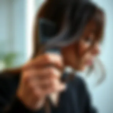 Person demonstrating proper technique for using a sleeker hair brush on wet hair