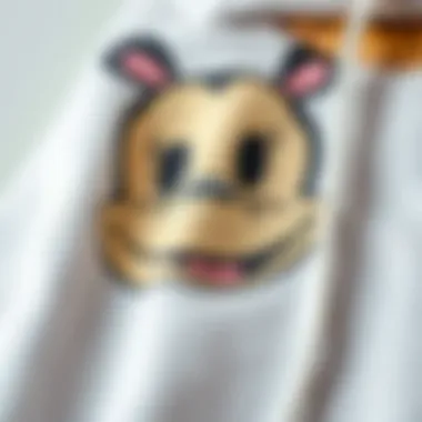 Quality Fabric of Cartoon Character Hoodies Close-up of soft fabric texture of a hoodie featuring a beloved cartoon character, highlighting its quality.