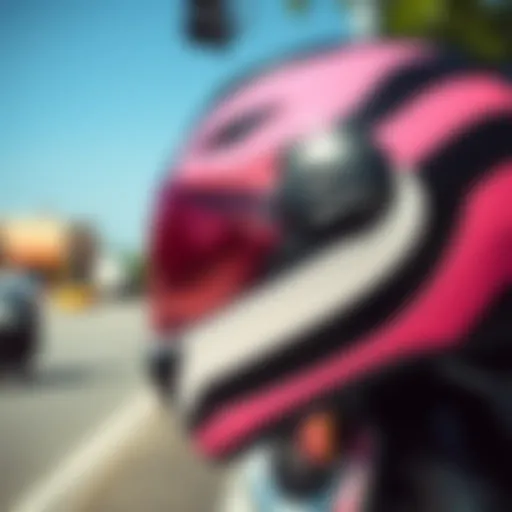 A stylish pink and black motorcycle helmet showcasing elegant design elements.