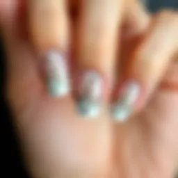 Elegant French nail design with intricate stamping patterns