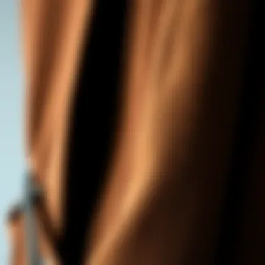 A close-up view of a luxurious brown duster cardigan showcasing intricate fabric texture.