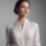 A classic white blouse elegantly draped on a minimalist background