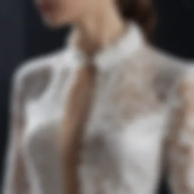 Close-up of intricate lace detailing on a white blouse