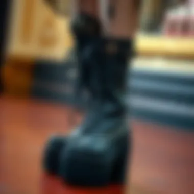 A close-up of intricate platform boots adorned with gothic motifs