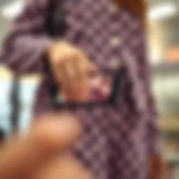 A stylish phone purse showcasing its touch screen feature in action