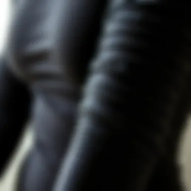 Materials Used in Long Sleeve Ruched Bodysuits Close-up of the fabric texture of a long sleeve ruched bodysuit.