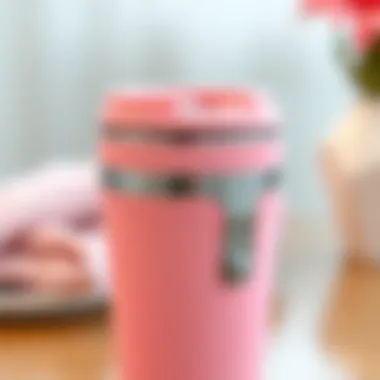 Unique Design Features Close-up of a pink travel coffee mug showcasing its unique design features